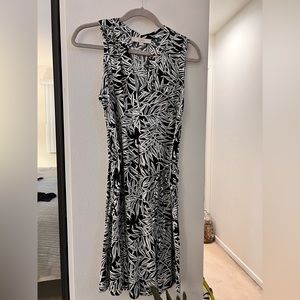 Black and white tropical print sleeveless knee length dress.
